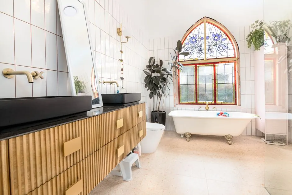 Luxurious bathroom in Melbourne featuring stained glass windows and modern decor.